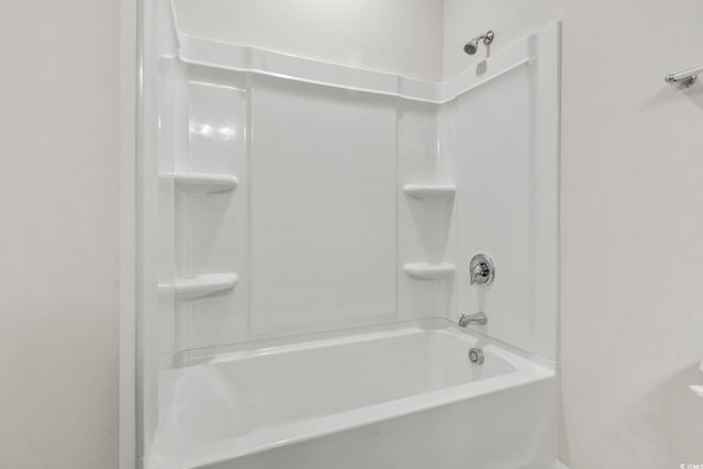 bathroom featuring washtub / shower combination