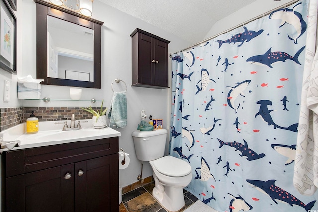 bathroom with vanity, a textured ceiling, toilet, and tasteful backsplash