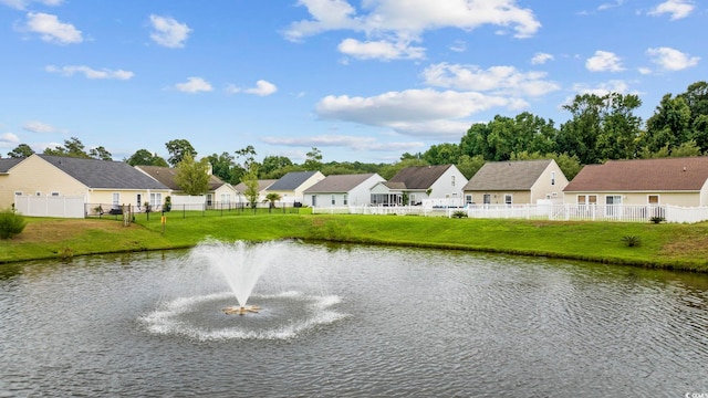 water view with a residential view and fence