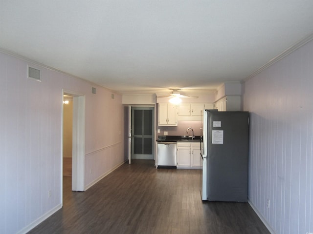 kitchen featuring white cabinetry, dark hardwood / wood-style floors, ceiling fan, and appliances with stainless steel finishes