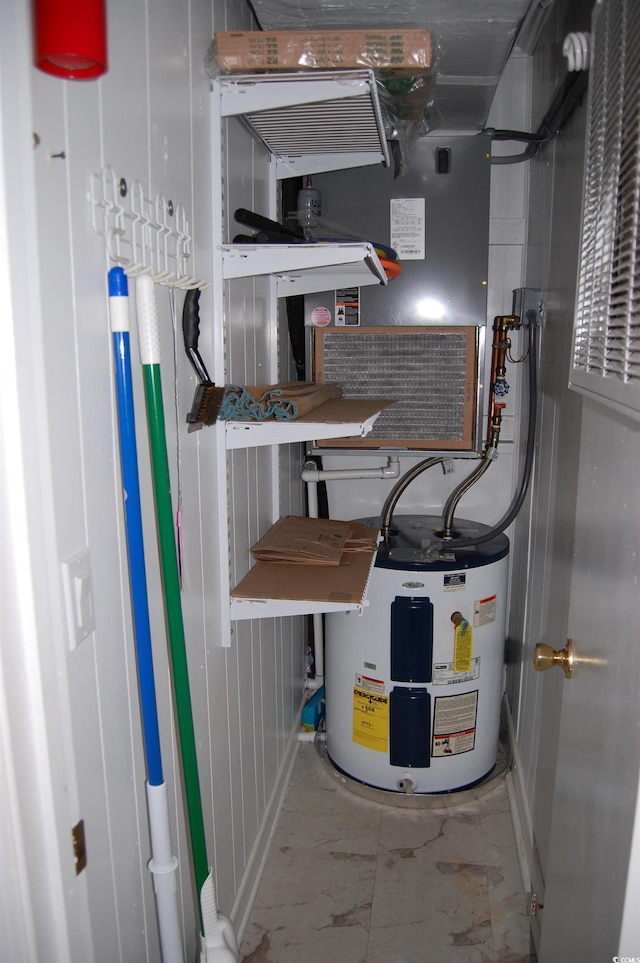 utility room with water heater