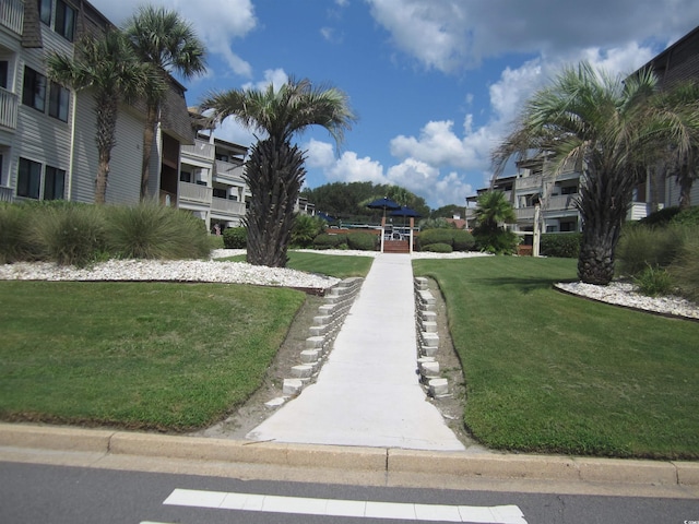 view of home's community featuring a yard