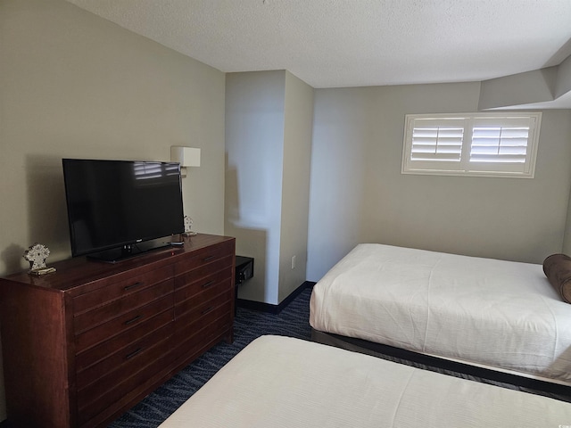 bedroom featuring a textured ceiling