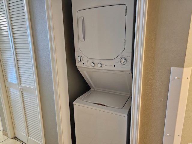 laundry room featuring stacked washing maching and dryer