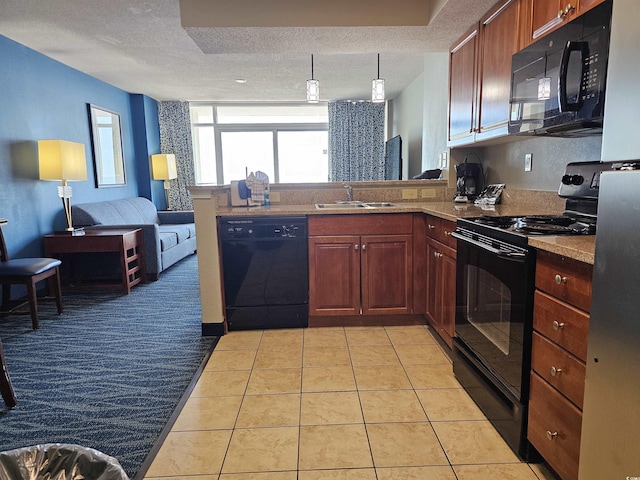 kitchen featuring black appliances, sink, light tile patterned floors, and a textured ceiling