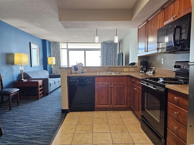 kitchen featuring a textured ceiling, sink, black appliances, light tile patterned floors, and decorative light fixtures