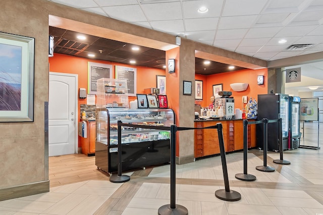 reception area featuring indoor bar