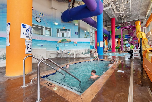 view of pool featuring a water slide