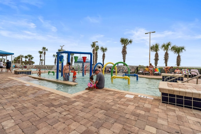 view of pool with pool water feature