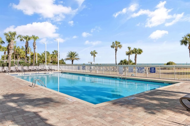 view of swimming pool with a patio area