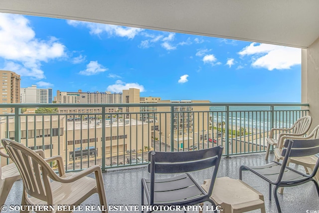 balcony featuring a water view