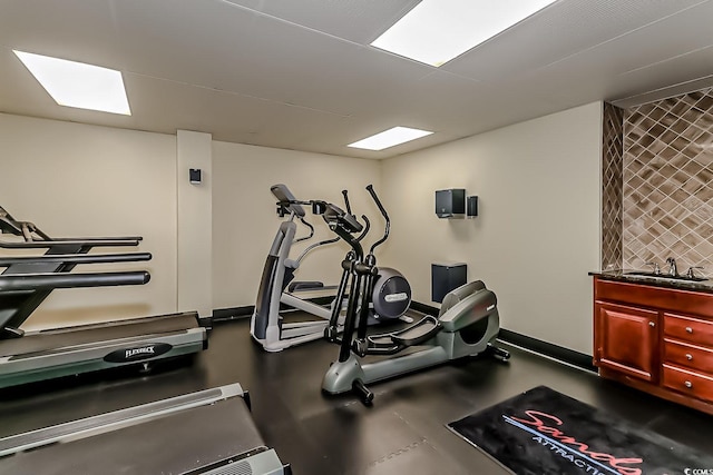 exercise room featuring sink