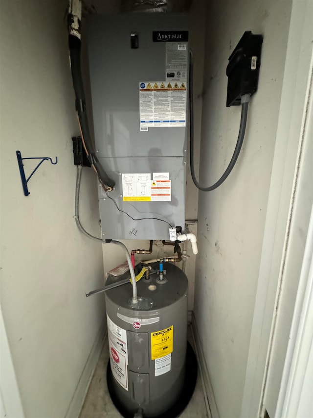 utility room featuring water heater