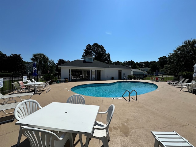 view of swimming pool featuring a patio area