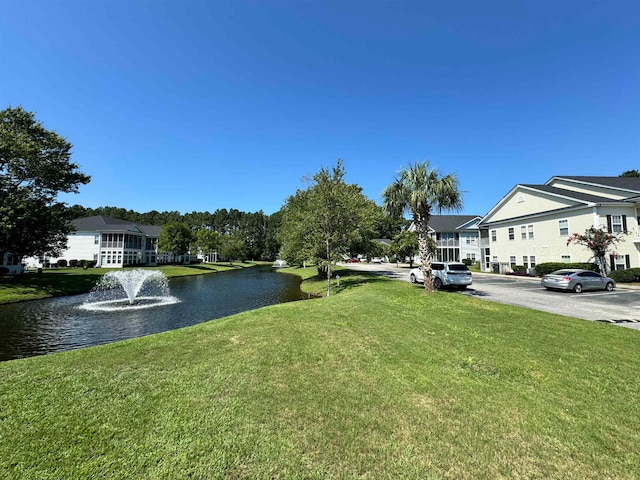 view of yard with a water view