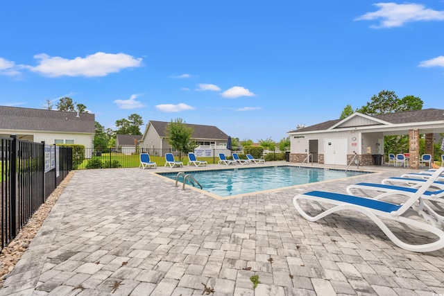 view of swimming pool featuring a patio area