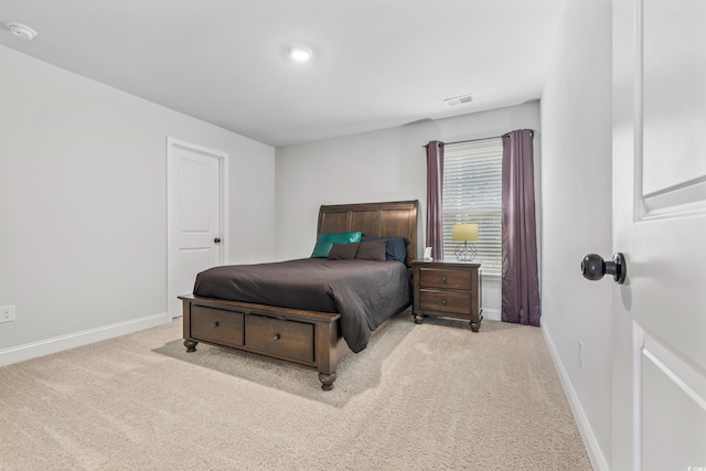 bedroom with light colored carpet