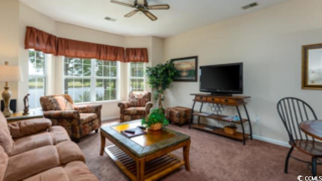 living room featuring ceiling fan and carpet flooring