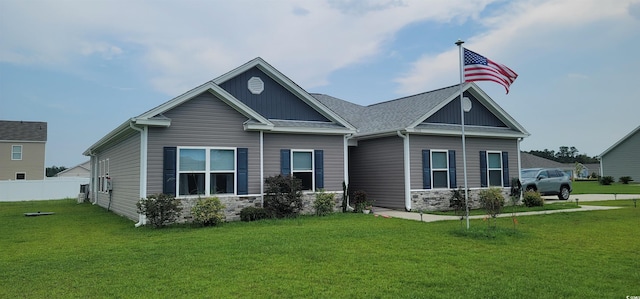 back of property featuring a lawn