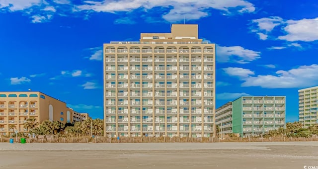 view of building exterior with a beach view