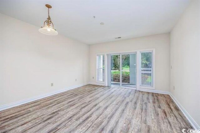 empty room featuring hardwood / wood-style flooring