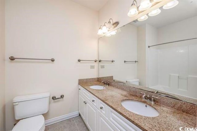 bathroom with toilet, walk in shower, tile patterned flooring, and vanity