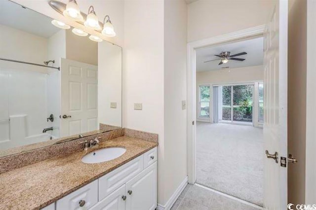 bathroom featuring ceiling fan, tub / shower combination, vanity, and tile patterned floors