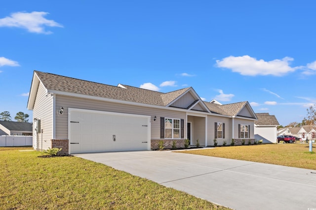 view of front facade with a front lawn and a garage