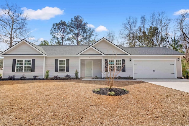 single story home featuring a front yard and a garage