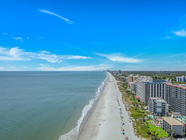 aerial view featuring a water view, a beach view, and a city view