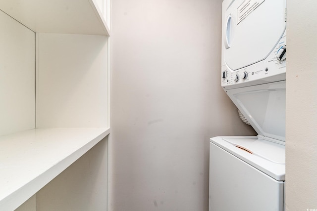 washroom with laundry area and stacked washing maching and dryer