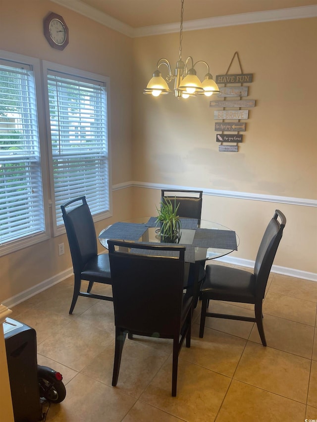 dining area featuring light tile patterned floors, crown molding, and a chandelier