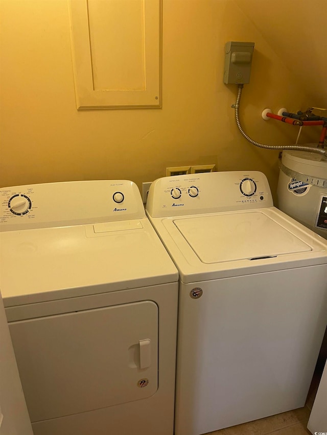 laundry area featuring separate washer and dryer and light tile patterned floors