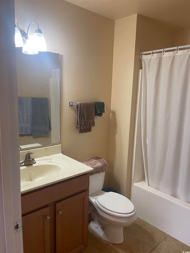 full bathroom with toilet, tile patterned flooring, shower / bath combo with shower curtain, and vanity