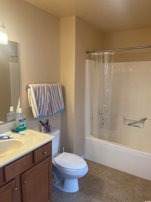 full bathroom featuring shower / tub combo with curtain, toilet, vanity, and tile patterned floors