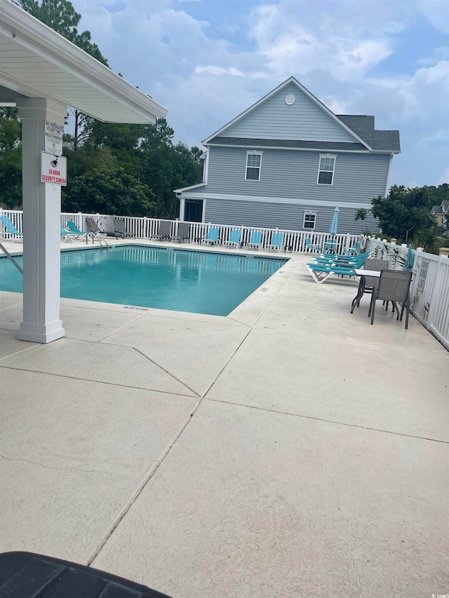 view of pool featuring a patio