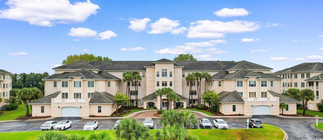 2180 Waterview Dr Unit 634, North Myrtle Beach, SC 29582 - view of building exterior with a residential view and a garage