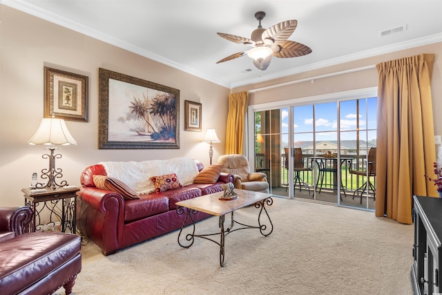 living room featuring ornamental molding, light colored carpet, and ceiling fan