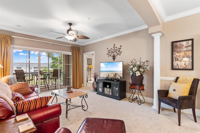 living room featuring ceiling fan, carpet floors, crown molding, and ornate columns