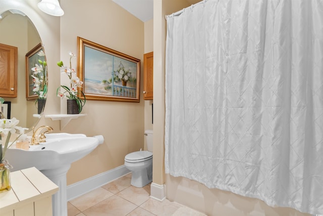 bathroom with tile patterned flooring and toilet