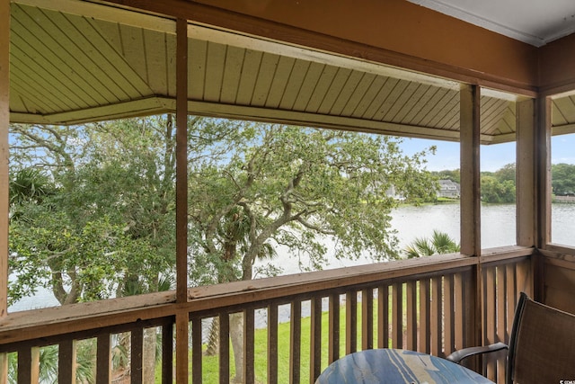 wooden deck featuring a water view