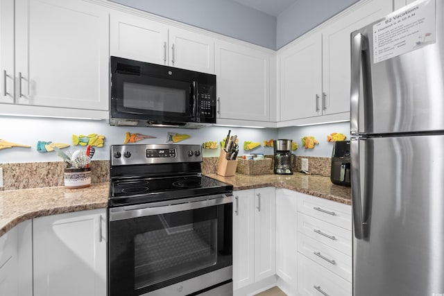 kitchen featuring white cabinets, appliances with stainless steel finishes, and stone counters