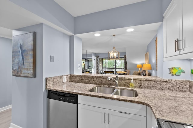 kitchen featuring sink, white cabinets, light hardwood / wood-style flooring, and appliances with stainless steel finishes