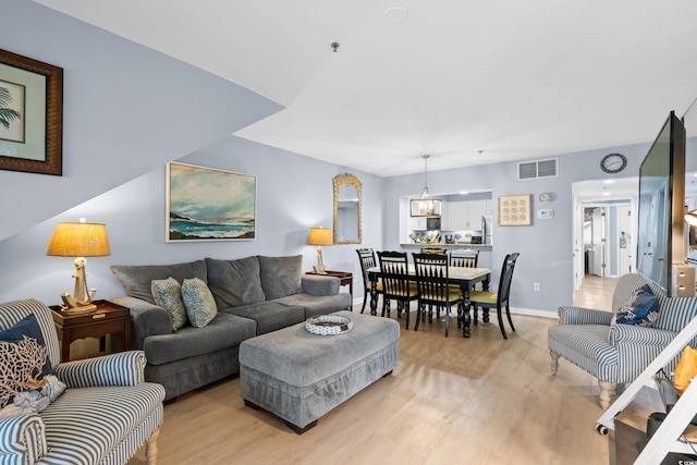 living room with light hardwood / wood-style floors