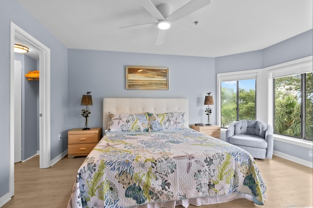 bedroom featuring ceiling fan and light wood-type flooring