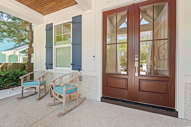 405 N Highland Way, Myrtle Beach, SC 29572 - doorway to property featuring covered porch and french doors