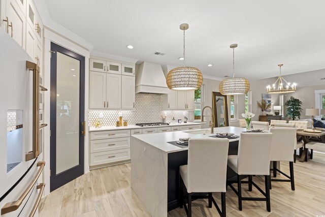 405 N Highland Way, Myrtle Beach, SC 29572 - kitchen featuring a sink, stainless steel gas stovetop, white fridge with ice dispenser, light countertops, and decorative backsplash