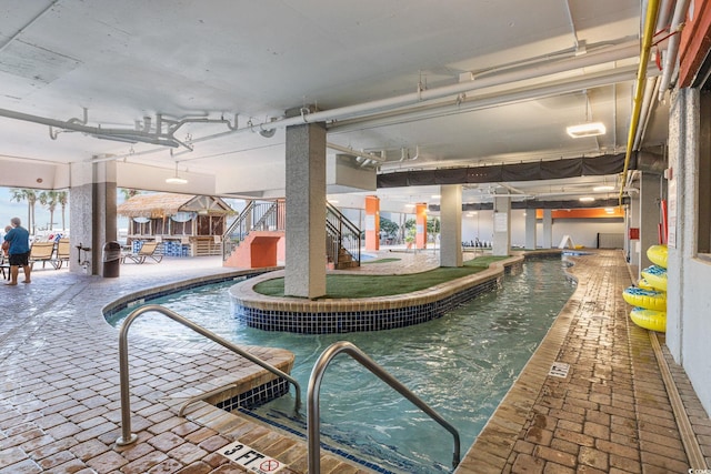 view of swimming pool featuring a jacuzzi