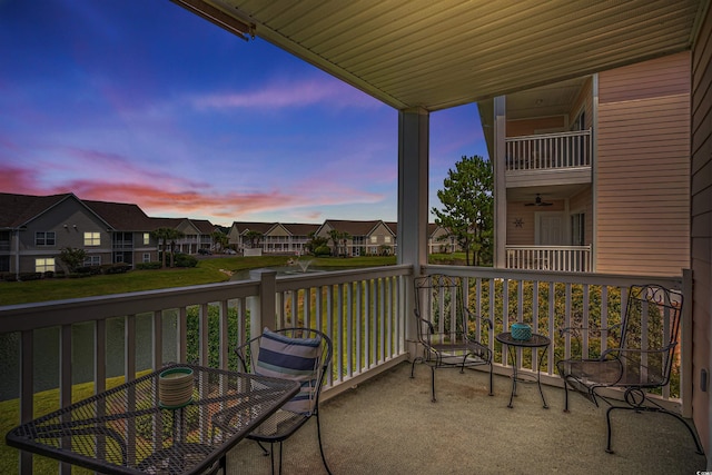 view of balcony at dusk