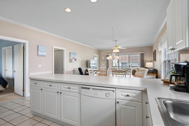 kitchen featuring light tile patterned floors, crown molding, white dishwasher, and white cabinets